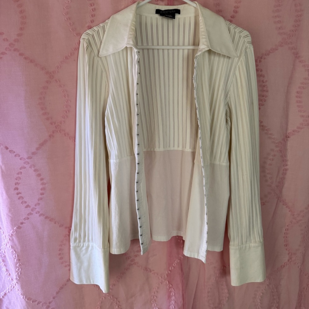 white stretchy button up blouse with hook closures closures